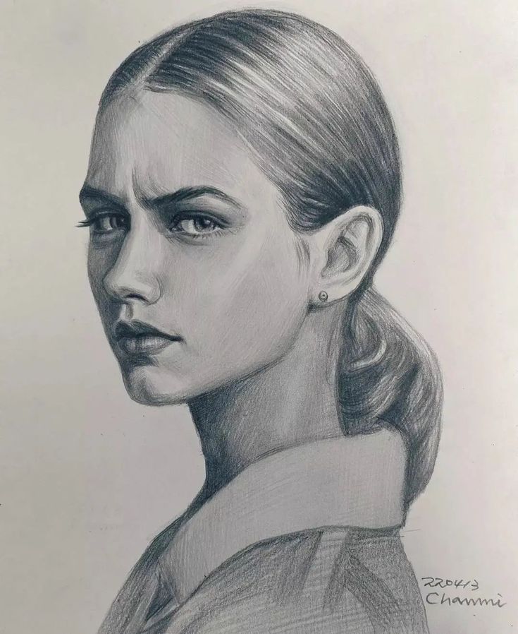 a pencil drawing of a woman's face in profile with her hair pulled back