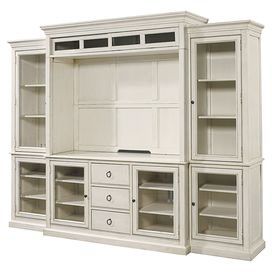 a large white entertainment center with drawers and shelves on each side, in front of a white background