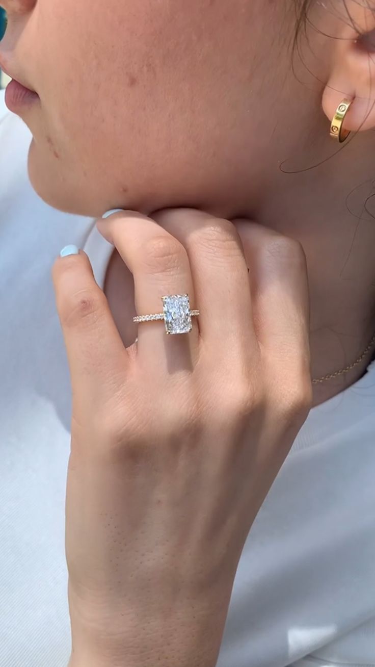 a close up of a person wearing a ring