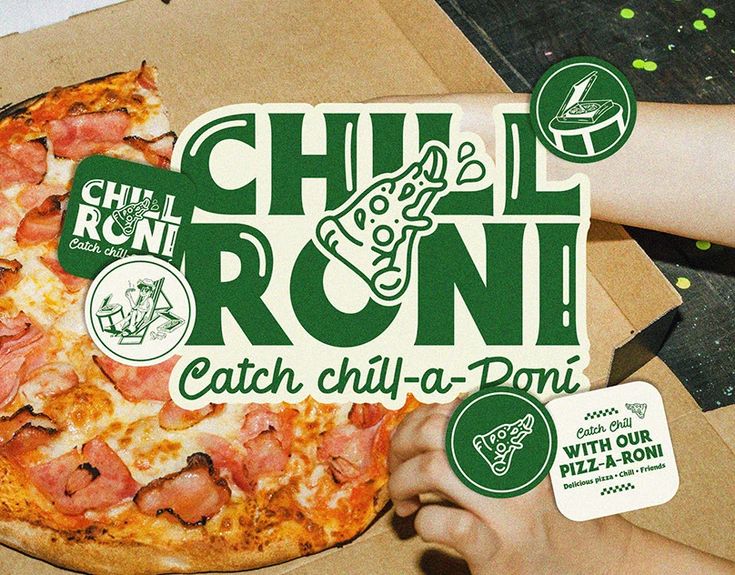 a person holding up a pizza in front of a cardboard box with the word chili roni on it