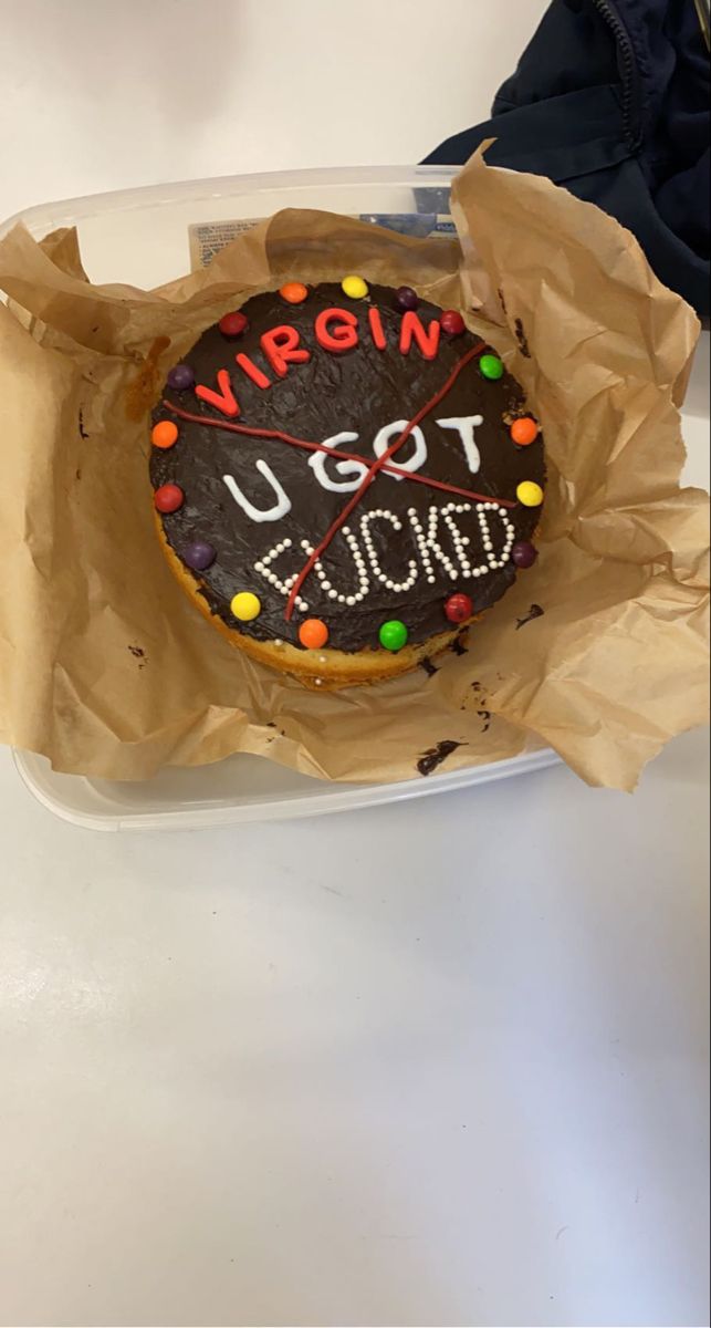 a decorated cookie in a brown paper bag with writing on it that says u got locked