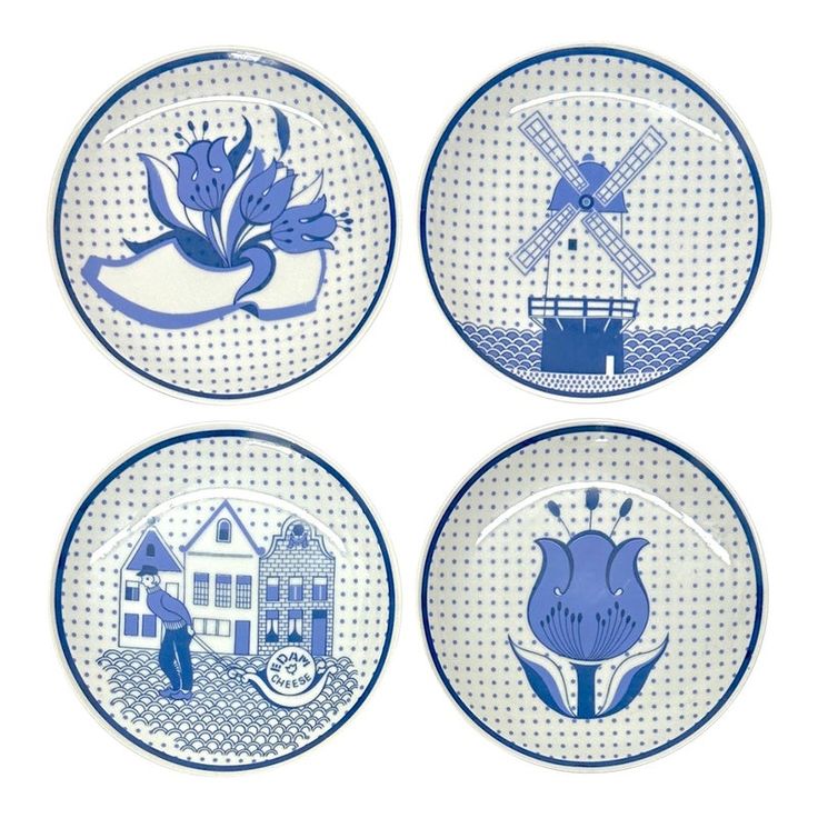 four plates with blue and white designs are shown in three different positions, one is holding a windmill