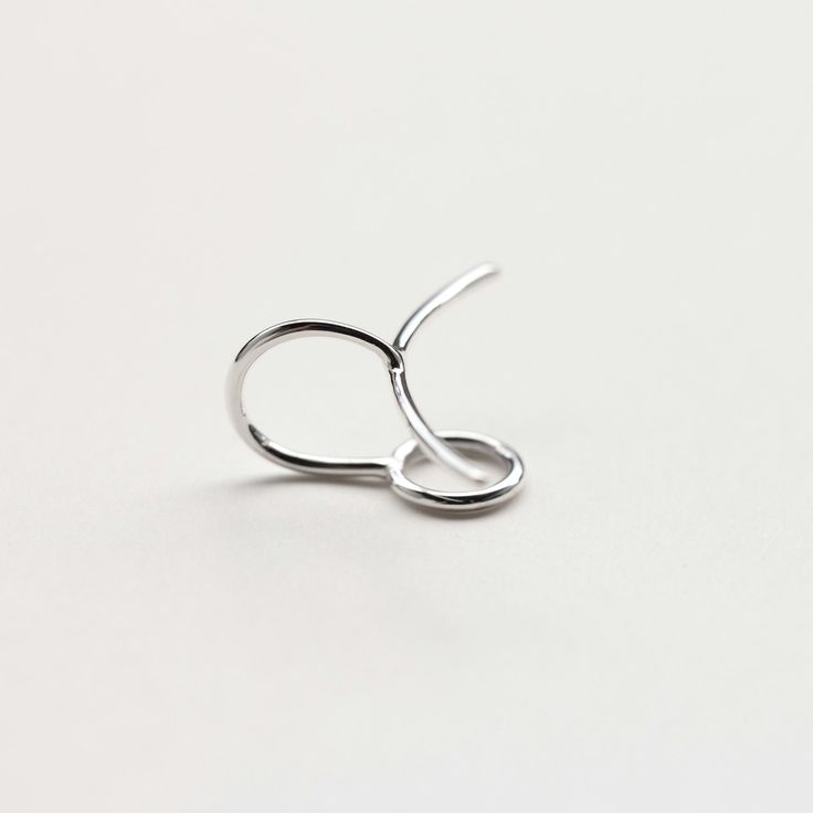 Handmade polished sterling silver ear cuff. A crescent line on the front, and a circle on the back to hold the cuff securely in place. Dimensions: 23x15mm Width: 1mm Sold: Individually or as a pair * Suitable for non-pierced ears. Also available in a longer version: https://www.etsy.com/listing/234077755/circle-long-line-sterling-silver-ear Visit my shop: http://www.etsy.com/shop/jewelrymirta © MIRTA Modern Silver Pierced Ear Cuff, Sterling Silver Small Hoop Ear Cuff For Everyday, Modern Sterling Silver Pierced Ear Cuff, Everyday Small Hoop Sterling Silver Ear Cuff, Elegant Small Hoop Sterling Silver Ear Cuff, Elegant Sterling Silver Small Hoop Ear Cuff, Everyday White Gold Sterling Silver Ear Climbers, Minimalist Small Hoop Ear Cuff, Modern Silver Adjustable Cartilage Earrings