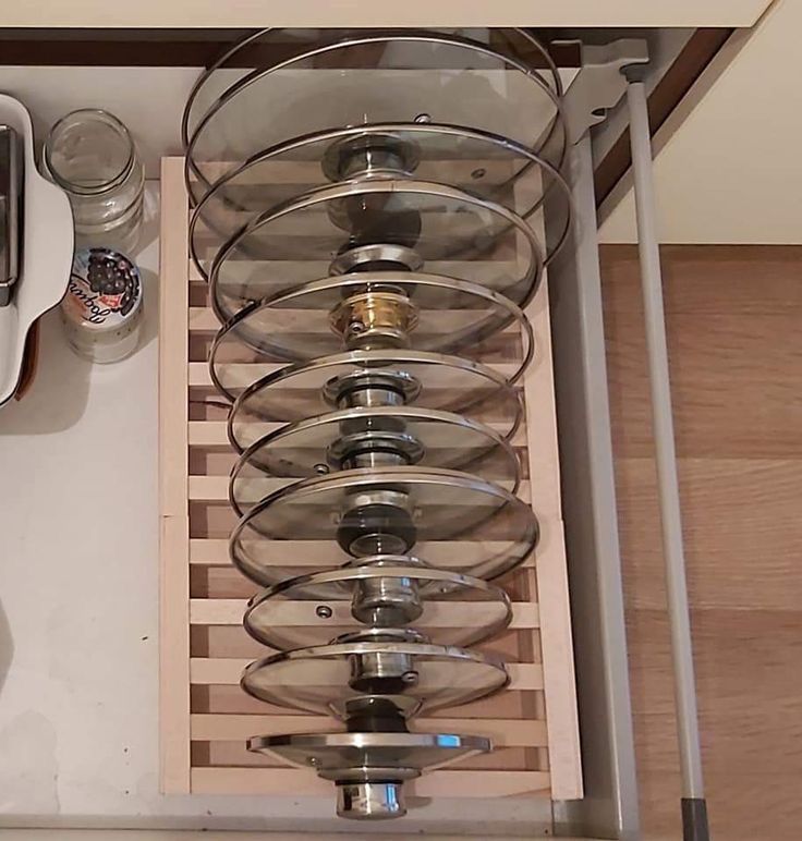 an overhead view of a kitchen counter with dishes and utensils in the drawer