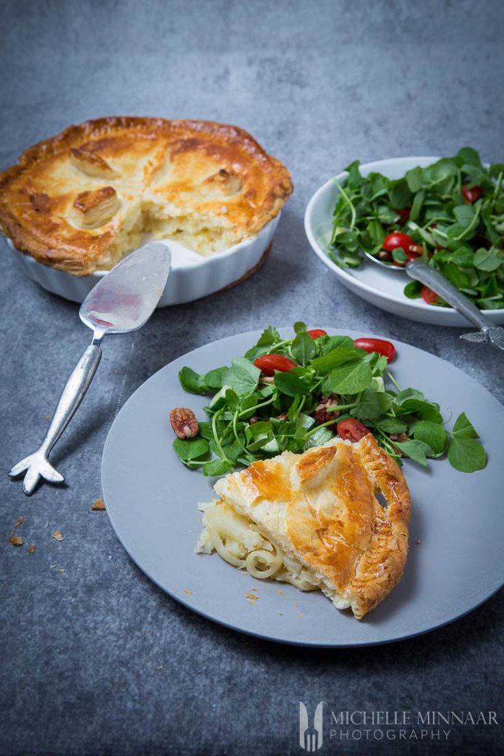 there is a pie and salad on the plate