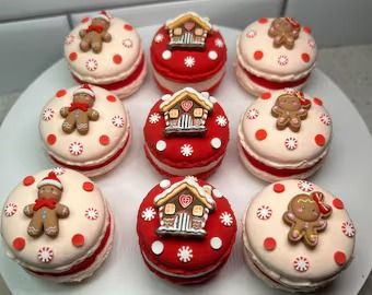 twelve decorated cupcakes on a white plate