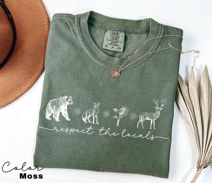 🌿 Show your love for nature with our minimalist "Respect the Locals" 2024 Shirt!  Featuring a simple design that's  perfect for the granola girl, hiking enthusiast, and camping lover. Embrace the outdoors and promote a message to protect the wildlife. Ideal for nature lovers who cherish the wild. 🌸👕 #RespectTheLocals #ProtectTheWildlife #MinimalistFashion #NatureLover #GranolaGirl #HikingGear #CampingLife #WildlifeAppreciation #OutdoorStyle Comfort Colors Tee *SIZING* - Please refer to size c Nature Lover Gifts, Nature Style Clothing, Shirt Print Design Ideas, Camp Tshirt Designs, Camping Outfit, Respect The Locals, Nature Shirts, Shirt Print Design, Hiking Shirts