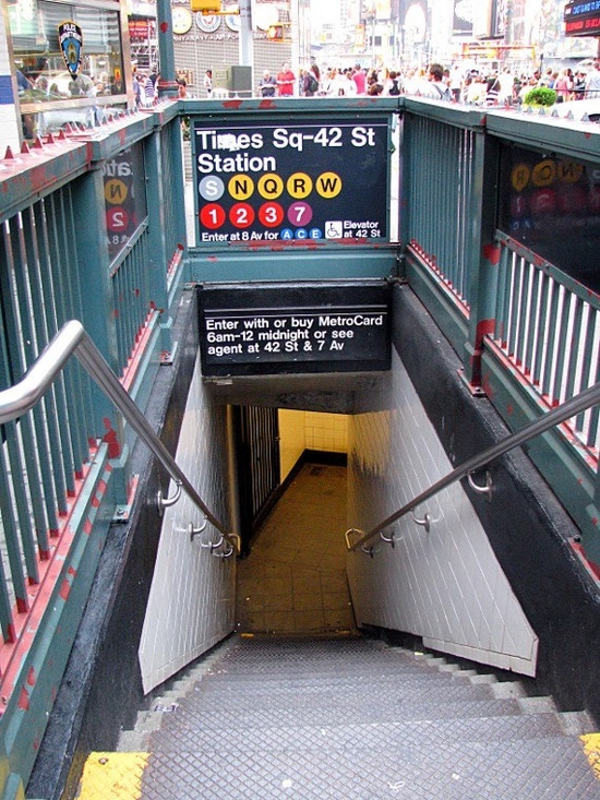 an escalator going up to the subway station