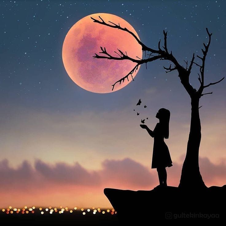 a girl is standing in front of a tree and looking at the moon