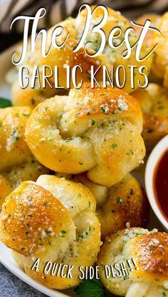 garlic knots on a plate with dipping sauce