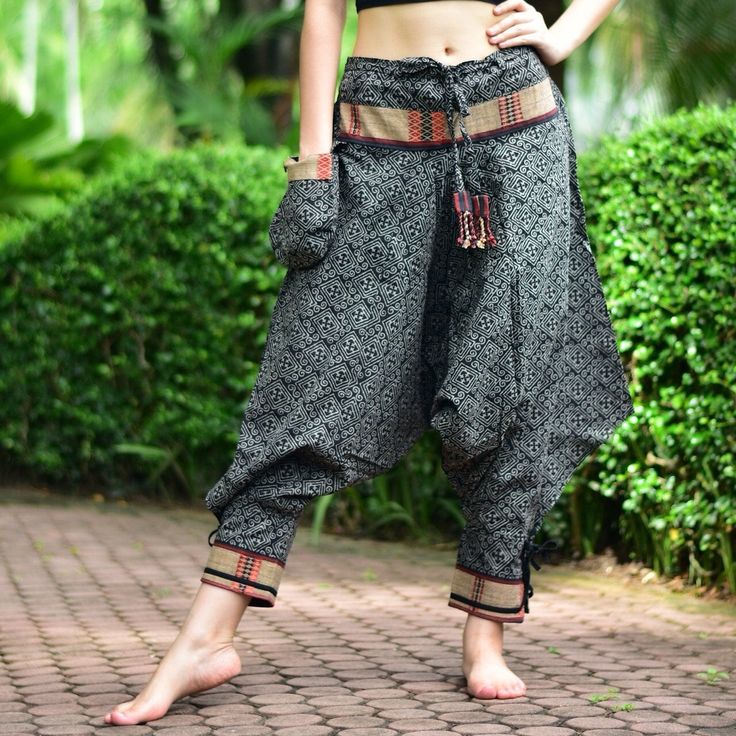 "Black Thai Traditional pattern pants, Hmong pants, Traditional Thai pants, Harem pants, Unisex pants Tribal pants is very comfortable and easy to wear, Unisex for Men and Women Every Detail of Tribal pants is made by Thai Craftsmanship. Tribal pants is inspired by Tribal in the North of Thailand or Hmong. Redesign for easy to wear and comfy. Great for many occasion activities like Chilling time, Casual wear, Relax time. This item is made of high-quality cotton in the north of Thailand. Printed Black Harem Pants With Pockets For Festival, Traditional Harem Bottoms With Pockets, Black Harem Pants For Festival, Black Bohemian Harem Pants Ankle-length, Traditional Black Wide Leg Bottoms, Black Bohemian Ankle-length Harem Pants, Black Bohemian Ankle-length Pants, Traditional Black Harem Pants, Traditional Black Harem Pants For Festival