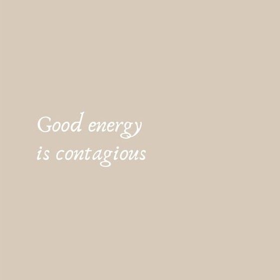 the words good energy is contagious written in white ink on a beige background