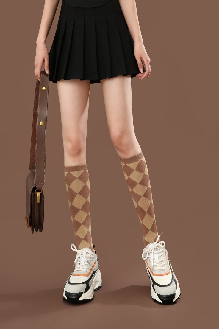 Plushell Elegance Knee High Bamboo Viscose Socks, where fashion meets functionality and your legs take center stage. These versatile and stylish socks are designed to add a touch of elegance and flair to any outfit. Crafted from premium bamboo viscose fibers, these knee-high socks offer a luxurious and eco-conscious option for those seeking both fashion and comfort. Color: Brown checkered pattern Length: Knee-High Thickness Scale: Airy Composition: 60% bamboo viscose +20% Nylon +17.4% polyester+ Brown Socks, Brown Checkered, Stylish Socks, Bamboo Socks, Comfort Color, Knee High Socks, Checkered Pattern, Center Stage, Eco Conscious