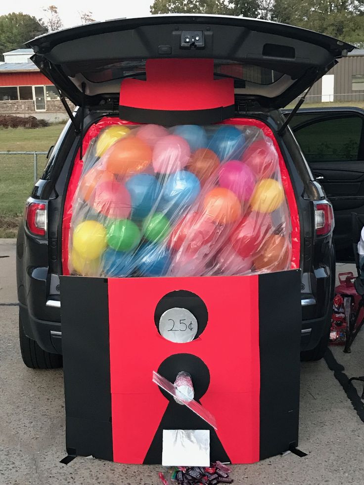 a trunk filled with balloons in the back of a truck