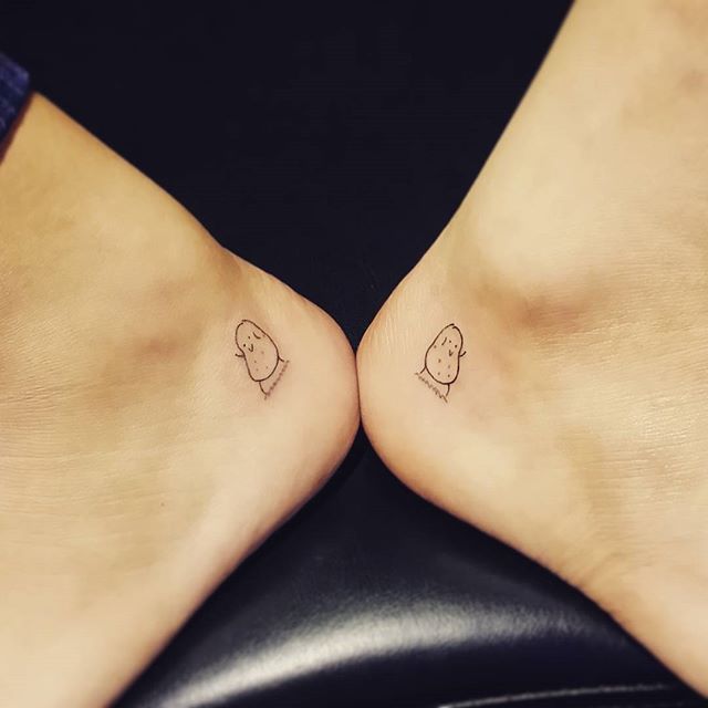 two people with small tattoos on their feet