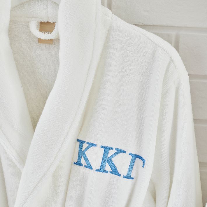 Personalize your robe with Greek lettering to show off your sorority pride! Our Quick-Dry Organic Collection checks all the boxes: eco-minded, 100% cotton, absorbent, lightweight and dries in a flash. KEY PRODUCT POINTS Made of 100% organic cotton terry. Long tie and sash to keep your robe comfy and cozy. Two pockets at the waist. Machine wash. Imported. SIZE INFORMATION Fits up to 6'1" tall Length: 43" Affinity Licensed Product - Used under license. Big Little Baskets, Monogram Robe, Cute Robes, Aphi Merch, Greek Lettering, College Wishlist, Monogram Robes, Embroidered Robe, Big Little Basket