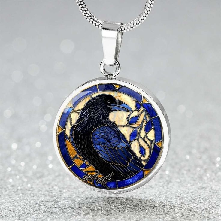 Our gorgeous pendant necklace in a faux stained glass effect makes a perfect  gift for a crow or raven lover. *Engraving option - select engraving option to add a short message on the back. Up to 2 lines of 20 characters including spaces.   Product Dimensions➜ Luxury Necklace: 18-22" (45-56cm) adjustable➜ Circle Pendant: 0.9" x 0.9" (23.5mm x 23.5mm) Our pendants are made of high quality surgical steel with a graphic image that's printed directly onto the steel surface with a bevelled glass coat Crow Pendant Necklace, Crow Or Raven, Raven Ring, Crow Pendant, Crow Necklace, Raven Jewelry, Raven Pendant, Raven Necklace, Stained Glass Effect