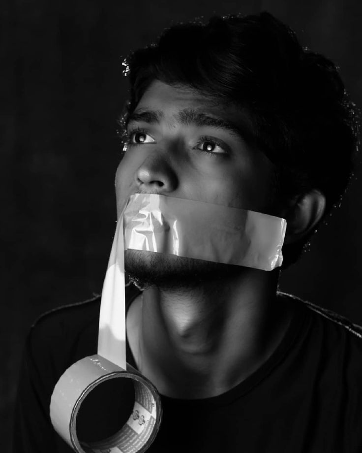 a man with duct tape around his mouth