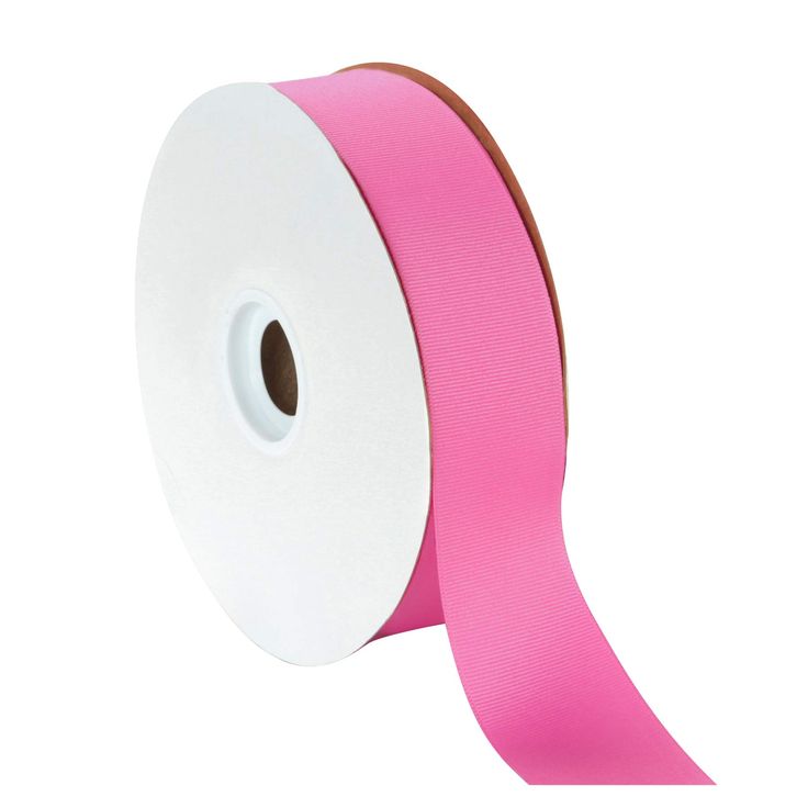 a roll of pink satin ribbon on a white background