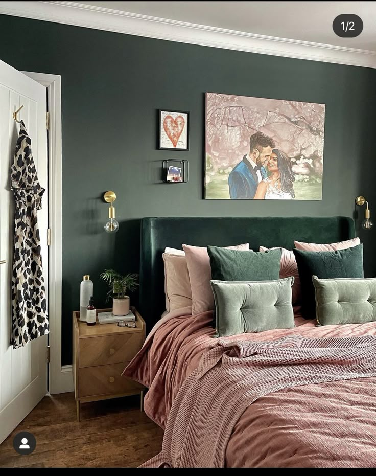 a bedroom with green walls and pink bedding