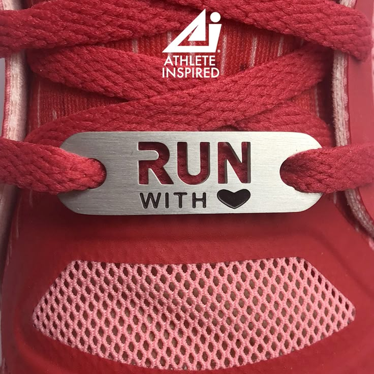 a red shoe with a metal tag that says run with love