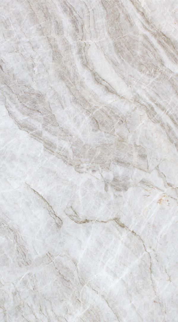 a white marble textured surface with light brown veiners on the top and bottom