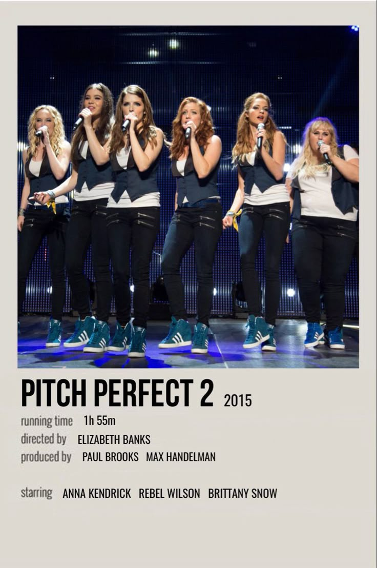 the girls are singing on stage with microphones in their hands and words pitch perfect 2 above them