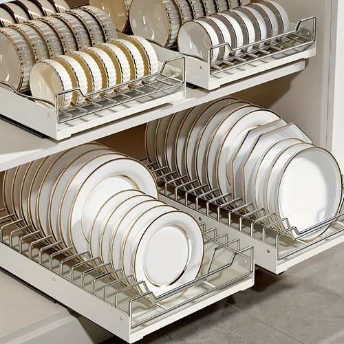 the dish rack is full of plates and silverware