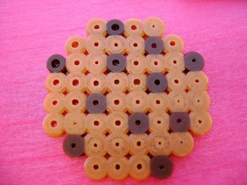 a group of buttons sitting on top of a pink table