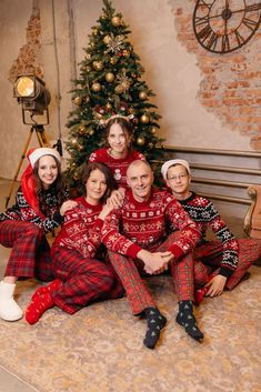 a group of people in matching christmas pajamas