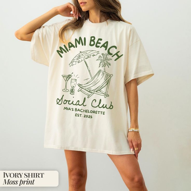 a woman wearing a white shirt with the words miami beach on it and a palm tree