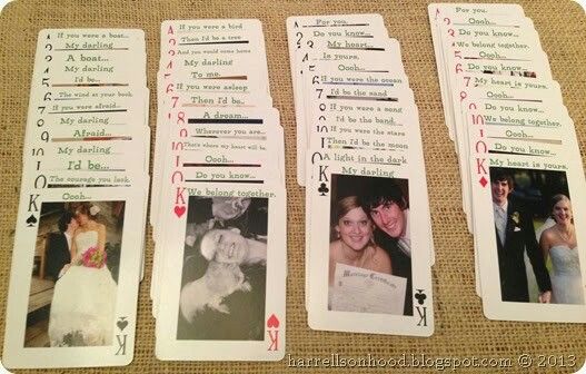 four playing cards with pictures of the same couple and their wedding date on them, sitting on a table