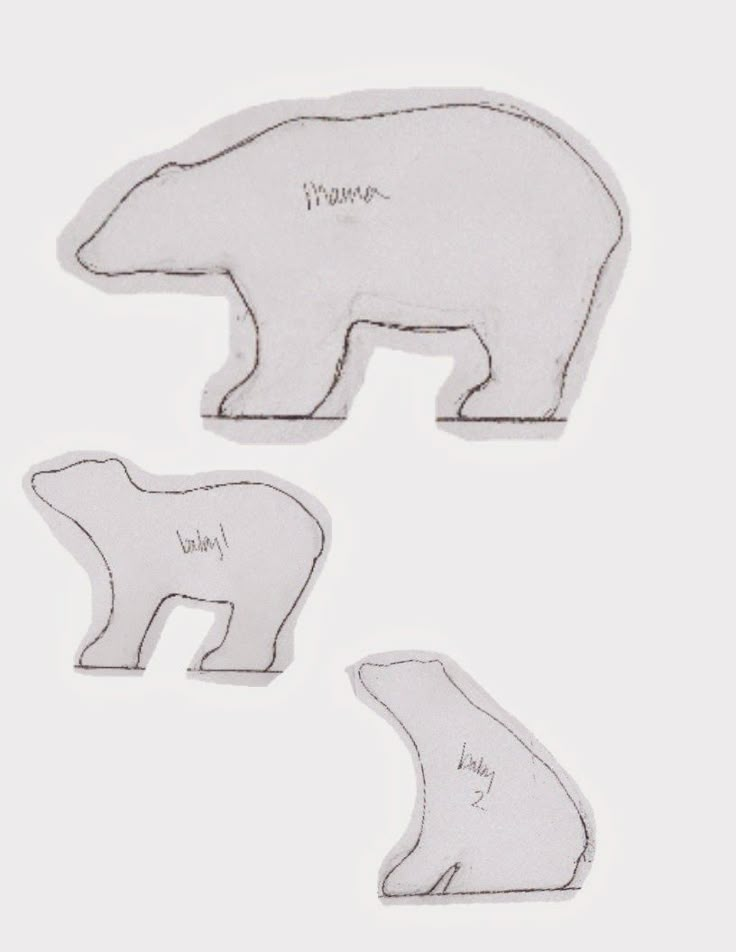 three polar bear shaped magnets with words on them