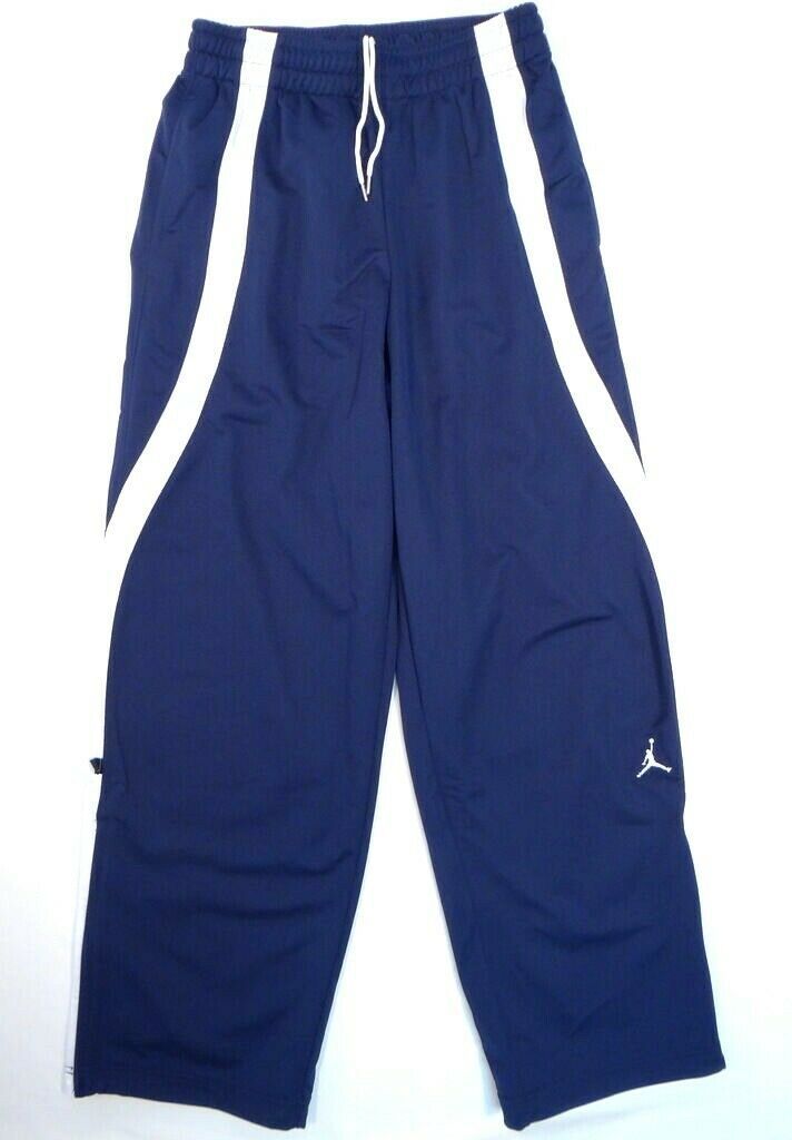 NIKE JORDAN JUMPMAN BASKETBALL TRACK PANTS - BRAND: NIKE - GENDER: MEN - JORDAN JUMPMAN - STYLE: BASKETBALL TRACK PANTS - COLOR: BLUE/WHITE - STYLE #: 509154 - Elastic Waist with Interior Drawstring - (2) Hand Pockets - (1) Back Right Pocket with Zipper Closure - Jordan Logo Boldly Embroidered in White on the Lower Left Side - Zippers at Outside Bottom Leg Seams - Bungee Cord Drawstrings at Cuffs - 100% Polyester Fabric: 100% Polyester MEASUREMENTS FOR VARIOUS SIZES: (approx) XS: Waist: (un-stre Navy Sweatpants For Streetwear, Navy Sporty Joggers For Streetwear, Track Pants Mens, White Basketball, Jordan Logo, Dance Team, Blue And White Style, Bungee Cord, Dance Teams