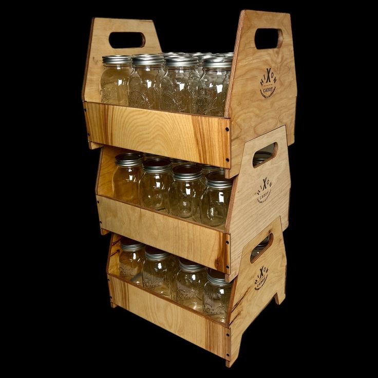 a wooden rack with mason jars on it's sides and two shelves holding them