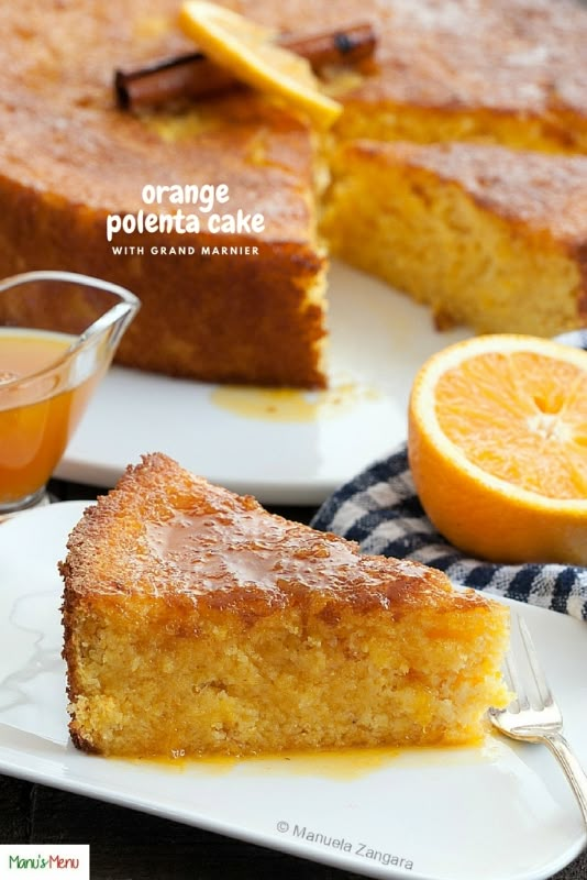 a slice of orange cake on a white plate