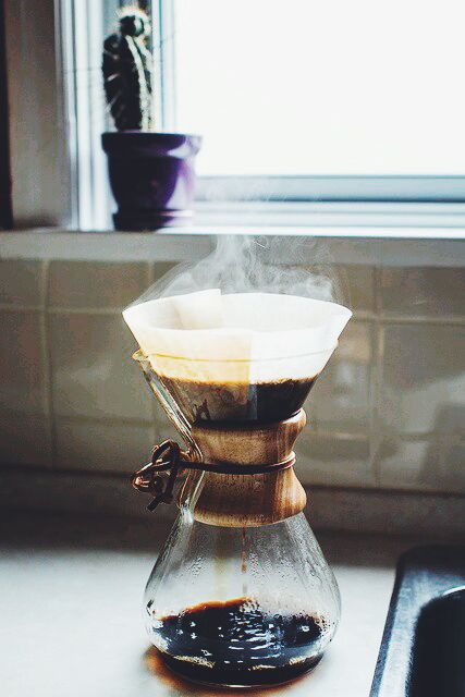 a coffee pot with steam rising out of it