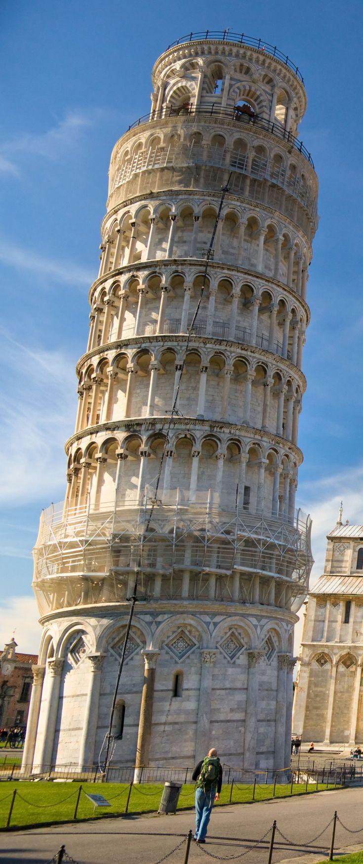 a man standing in front of the leaning tower