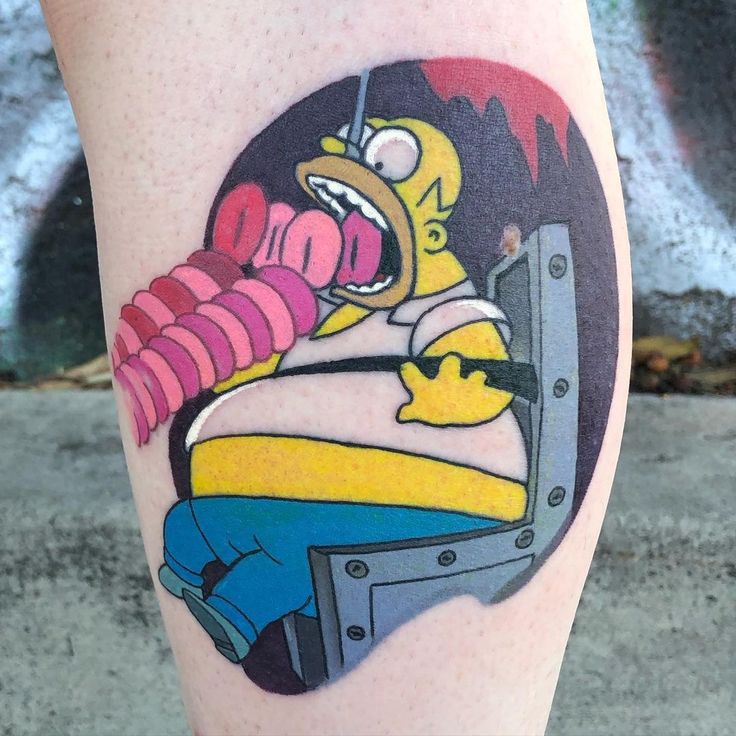 a cartoon character on the leg of a person