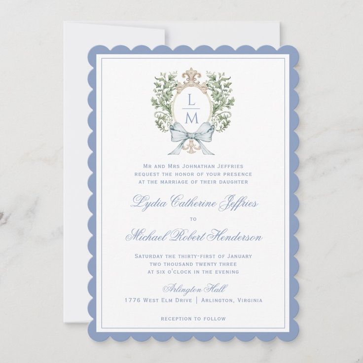 a wedding card with the letter l on it and an image of a wreath in the middle