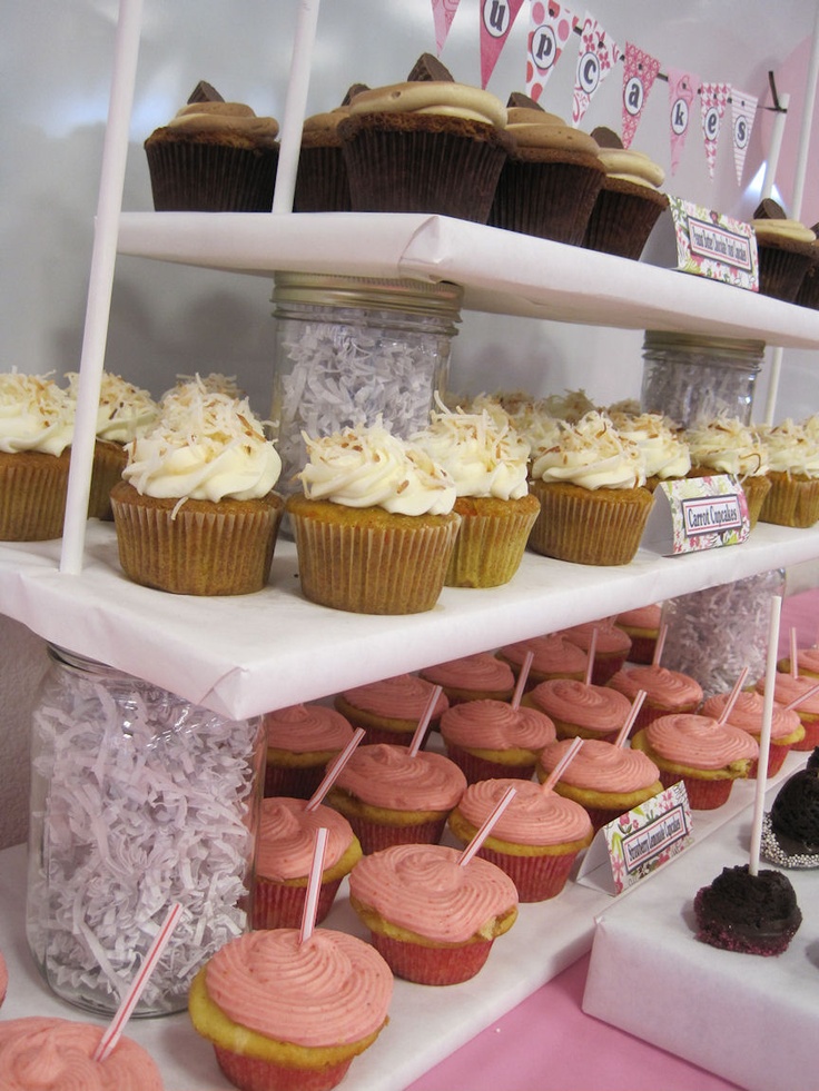 cupcakes and other pastries are on display