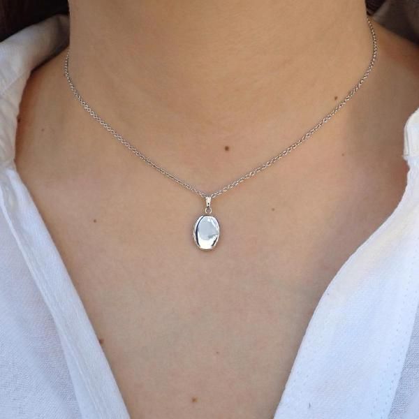 Measuring approx. 19 x 10 mm., fashioned in sterling silver. Suspended from a sterling silver cable chain. Length 15 inches. Contemporary Dainty Silver Locket, Locket Necklace Silver, Oval Locket Necklace, Silver Locket Necklace, Antique Locket, Oval Locket, Silver Locket, Silver Lockets, Locket Necklace