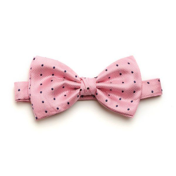 Pale pink pre-tied bow tie, with navy spots and designed from our finest woven silk 100% Silk One size with adjustable hook and eye fastening Dry Clean Only £36.00 Men's Bow Ties, Dapper Outfit, Silk Bow Ties, Pre Tied Bow Tie, Silk Bow, Crisp White Shirt, Tie Shop, Mens Bow Ties, Bow Ties