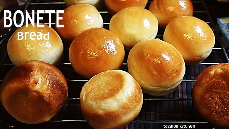 bread rolls cooling on a rack with the words bonette bread written above them in white