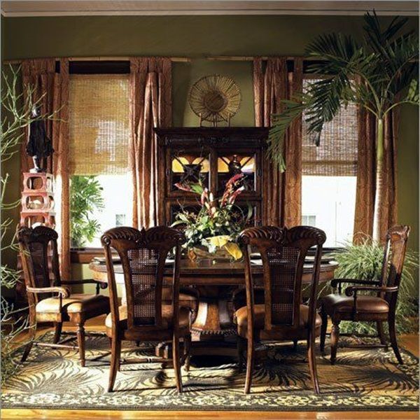 a dinning room table and chairs in front of a window with bamboo shades on the windowsill