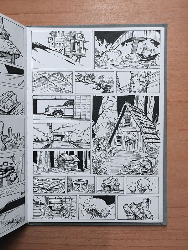 an open comic book with black and white illustrations on the pages, showing different scenes