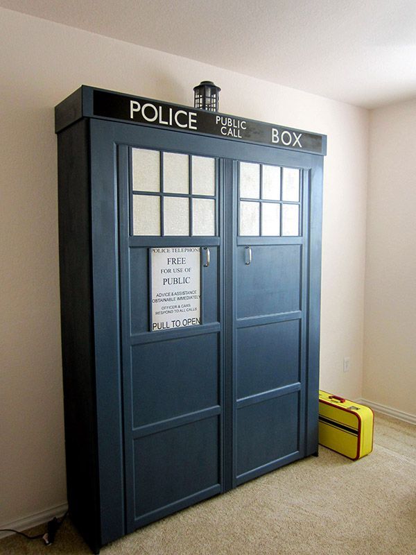 a blue police box sitting in the corner of a room