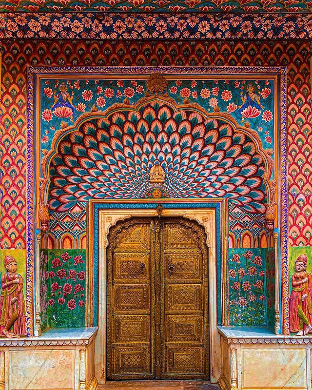 an intricately decorated building with wooden doors