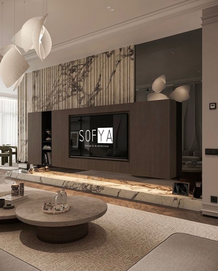 a living room filled with furniture and a flat screen tv mounted on the wall above it