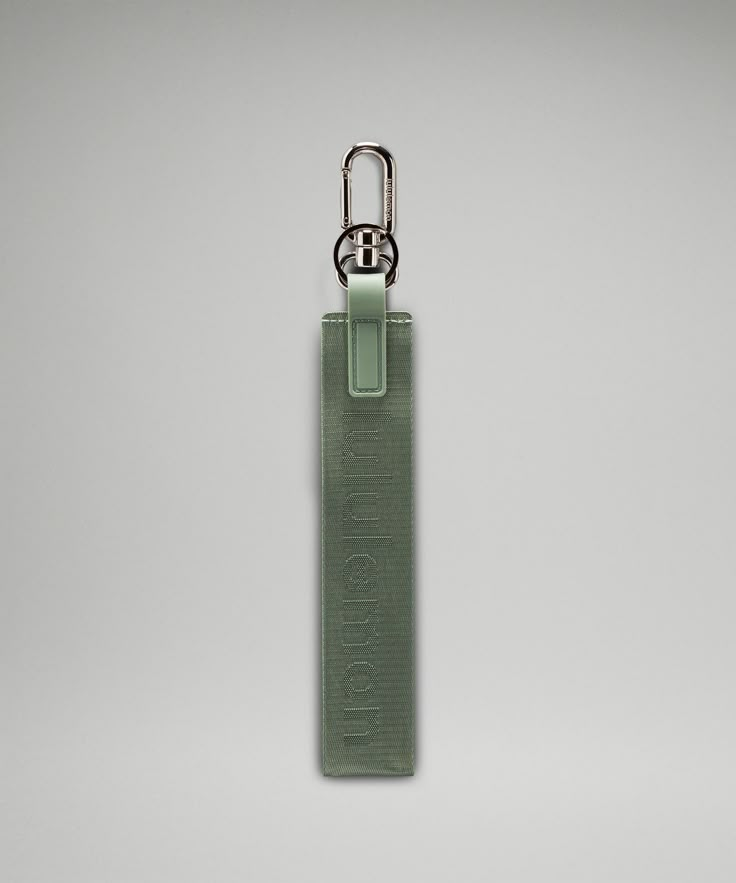 a green case with a metal hook attached to it